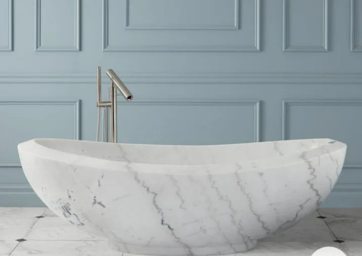 A freestanding Calacatta marble bath carved from a single block