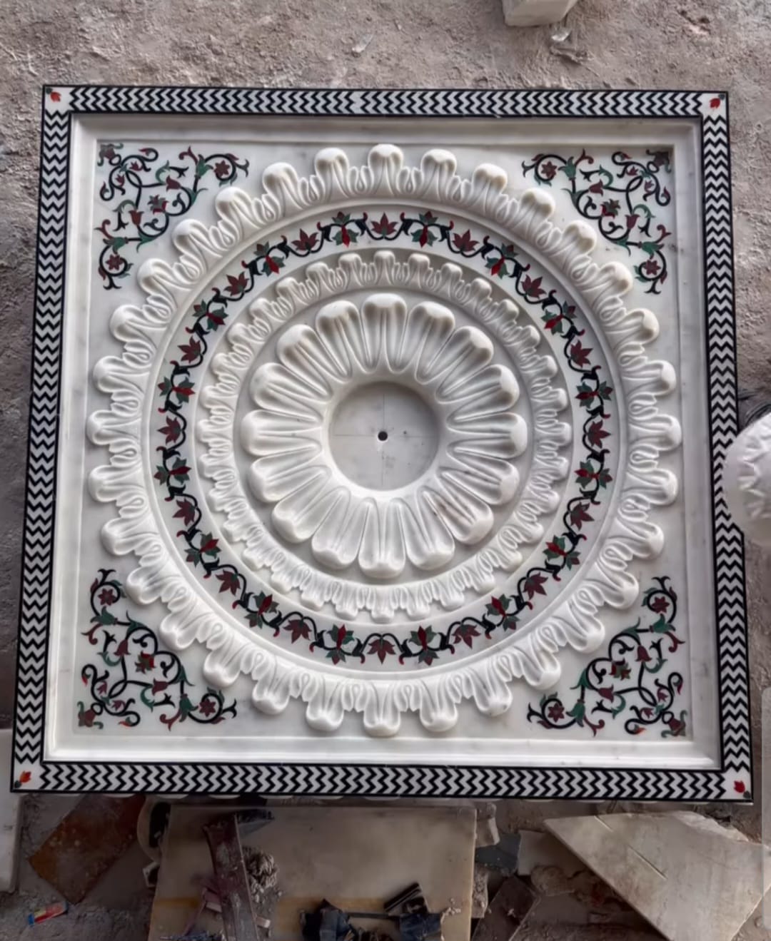 White marble floor medallion carved in relief and inlaid with semi-precious stone, made for marble flooring centrepieces
