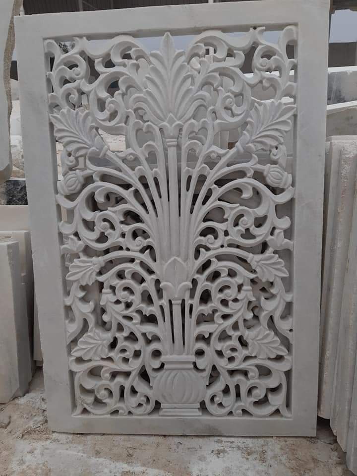 Deep hand-carved floral relief cut into white Makrana marble in the Sasdas Marble workshop at Makrana, Rajasthan